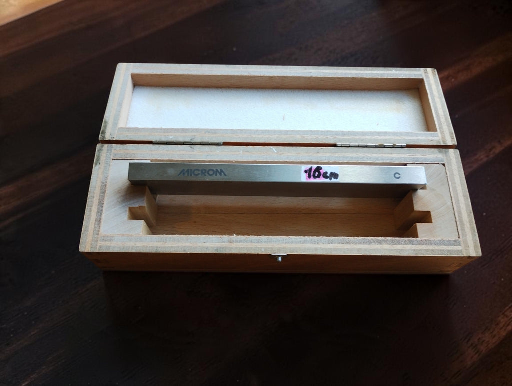 MICROM precision straightedge inside its fitted wooden storage case, with a handwritten 16 cm label.
