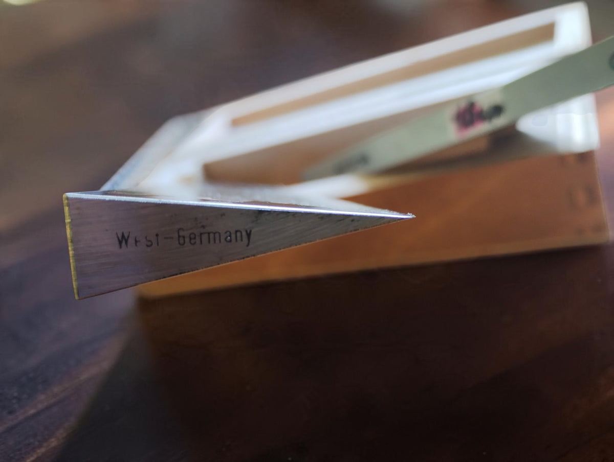 Close-up of the West-Germany marking on the tapered end of a MICROM knife-edge straightedge.

