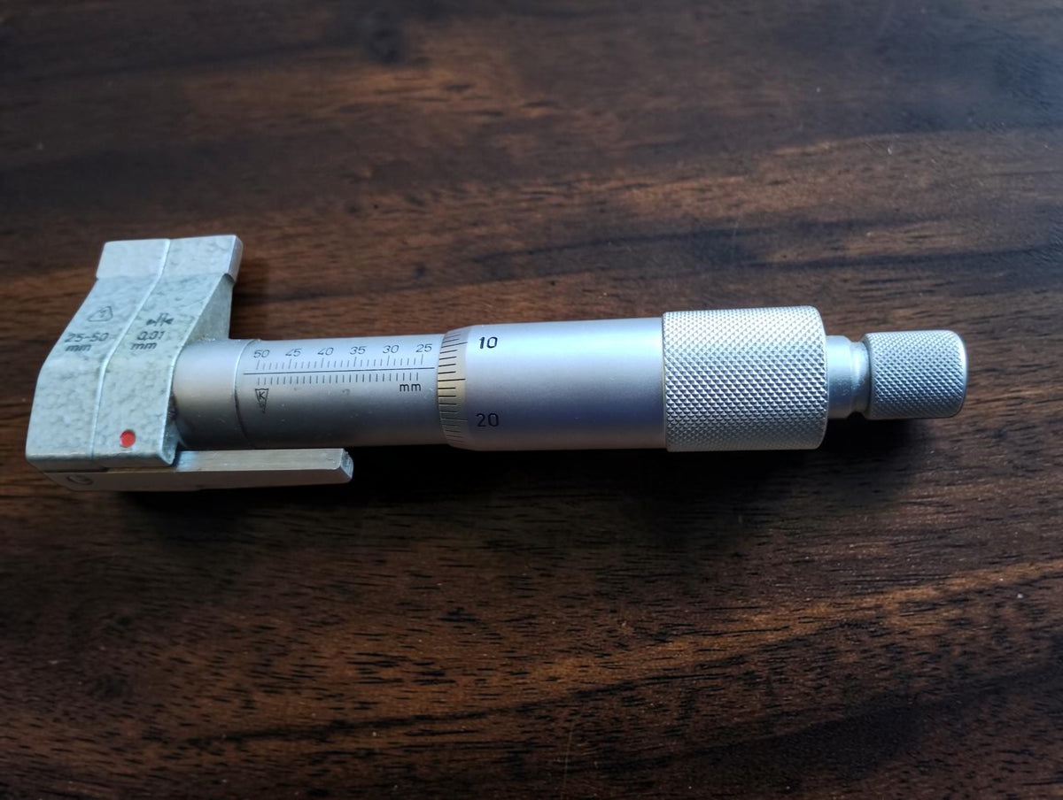 Side view of VEB Feinmess Suhl DDR inside micrometer showing the measuring head and adjustment barrel
