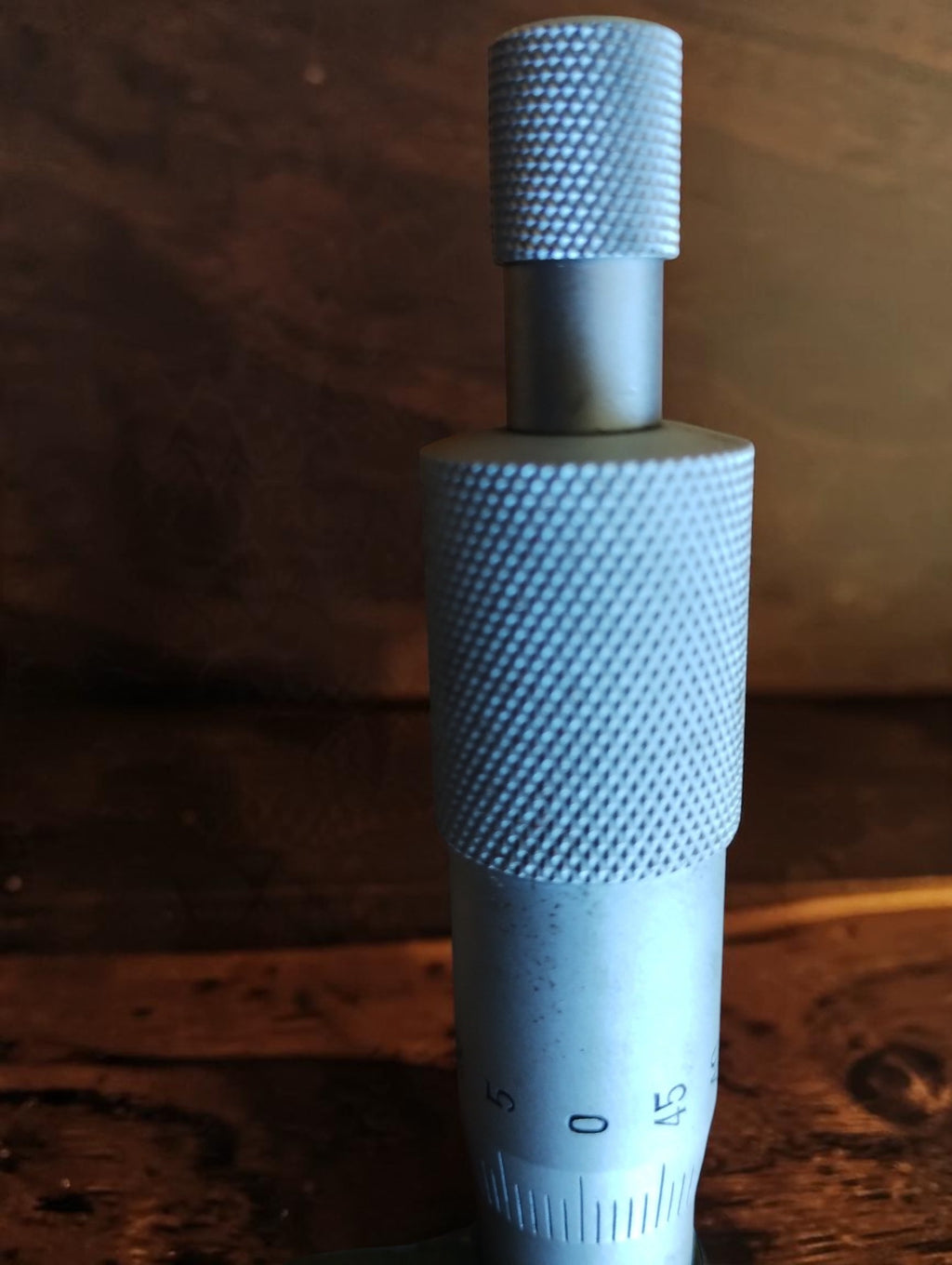 Close-up of the graduated thimble and knurled adjustment surfaces on the NOS Helios outside micrometer.
