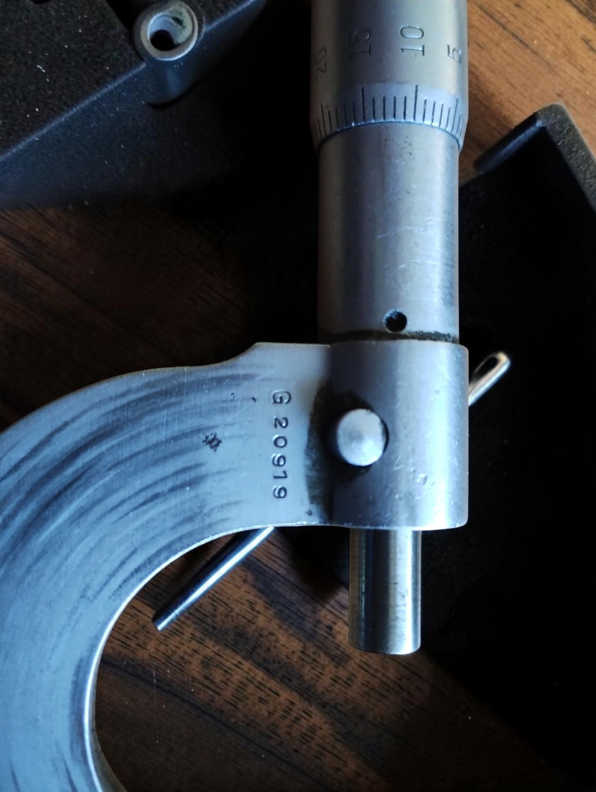 Close-up of NSK micrometer serial number G 20919, with spindle, locking lever and graduated scale.
