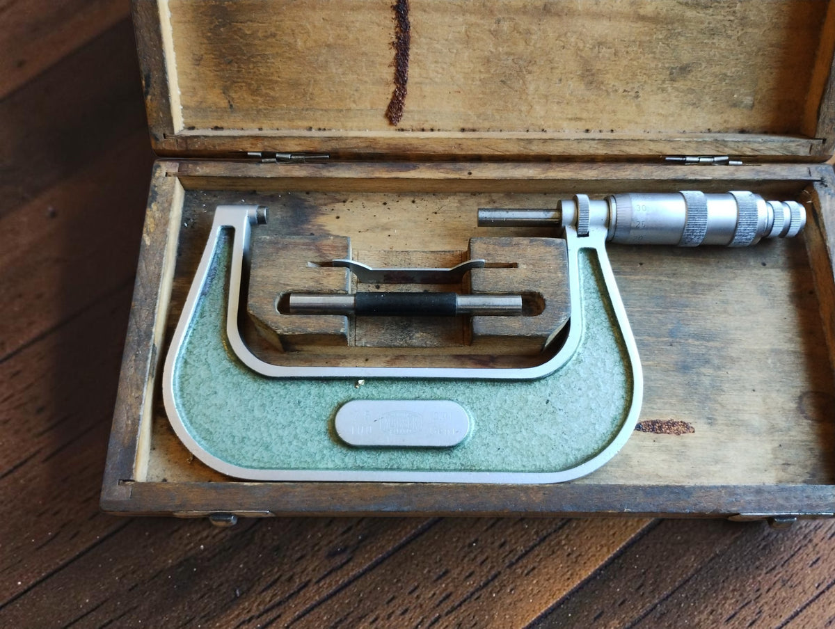 Vintage MAUSER 75–100 mm outside micrometer in an open wooden case with reference rod and adjustment wrench
