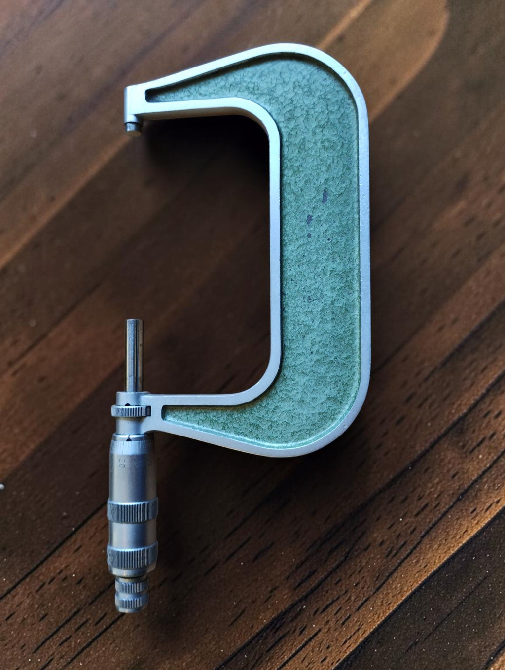 Vintage MAUSER 75–100 mm outside micrometer showing the green frame and metal measuring spindle

