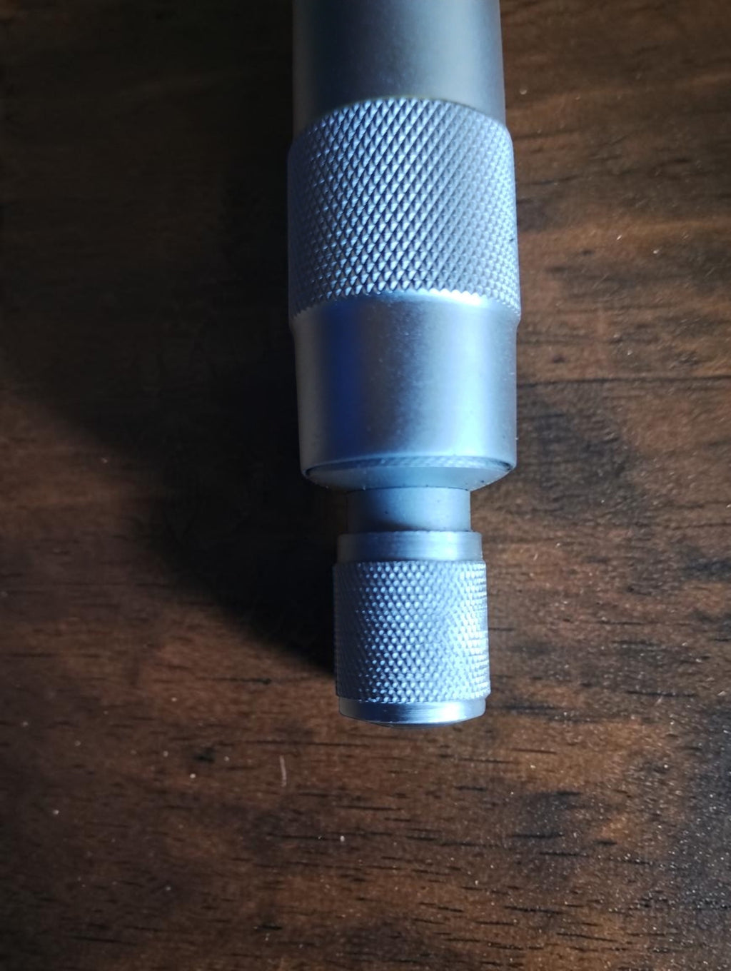 Detail of the knurled thimble and end knob on the vintage UIK outside micrometer.
