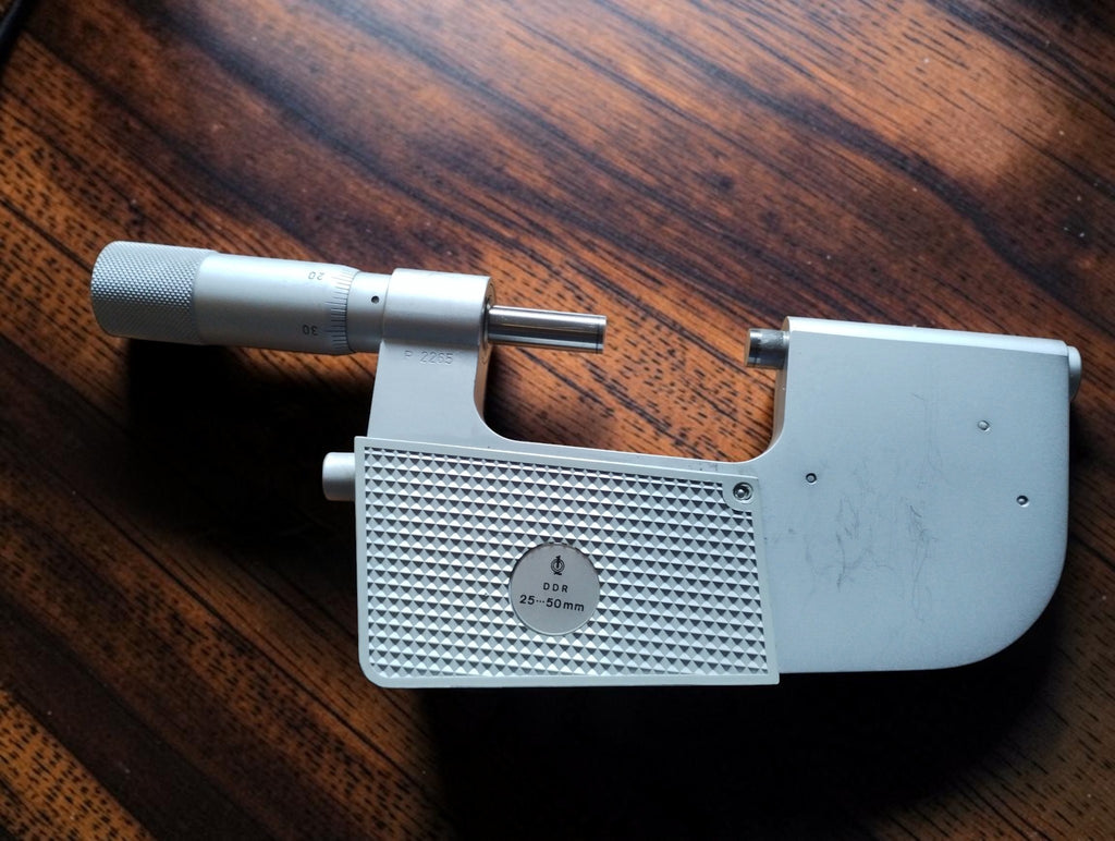 Rear view of the 25–50 mm indicating micrometer showing the DDR badge and micrometer thimble.
