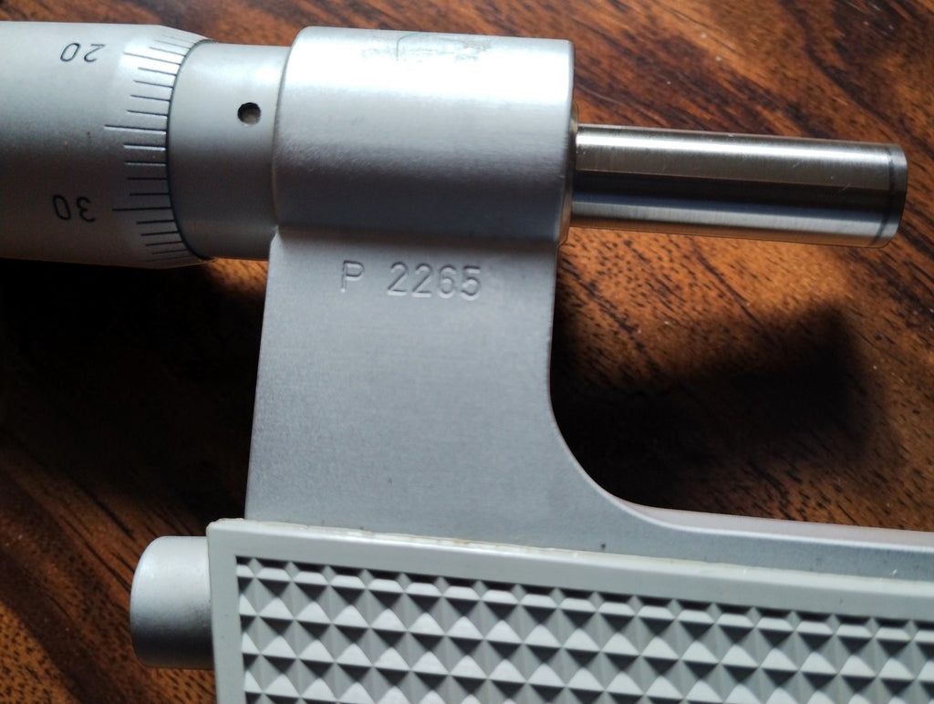 Close-up of the micrometer spindle and frame stamped P 2265.
