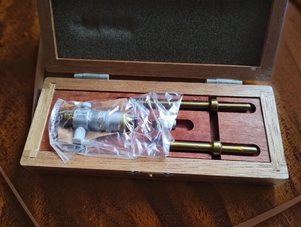 Somet 50–125 mm inside micrometer set in its open wooden case, NOS (New Old Stock), still in protective grease.

