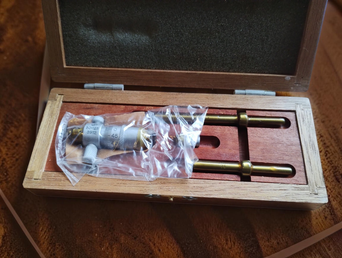 Somet 50–125 mm inside micrometer set in its open wooden case, NOS (New Old Stock), still in protective grease.
