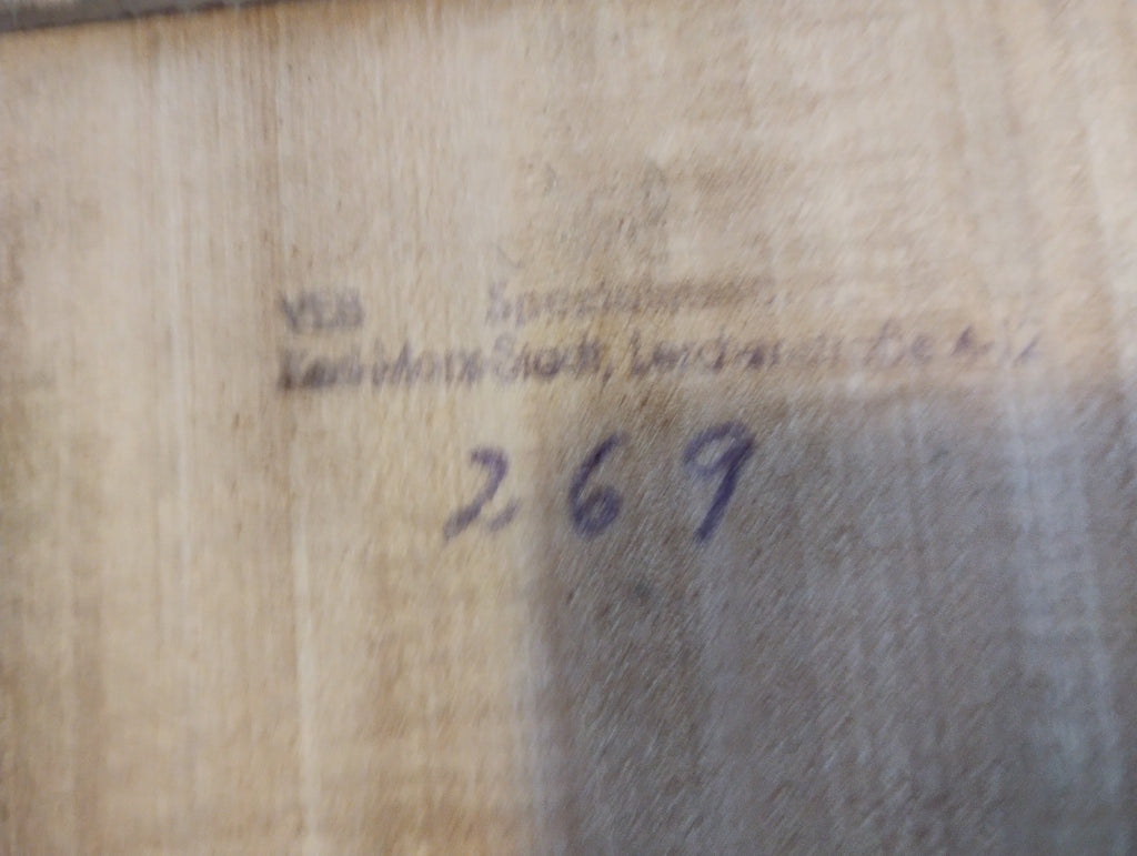 Faded stamp and handwritten number 269 on the wooden underside of the vintage apothecary set.
