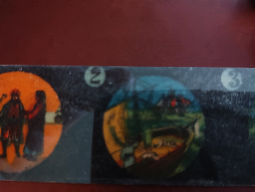 Close-up of illustrated scenes numbered 2 and 3 on an antique magic lantern glass slide.

