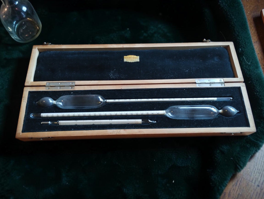 Gebr. Caminada Rotterdam set with two glass hydrometers and a Celsius thermometer in an open velvet-lined wooden case
