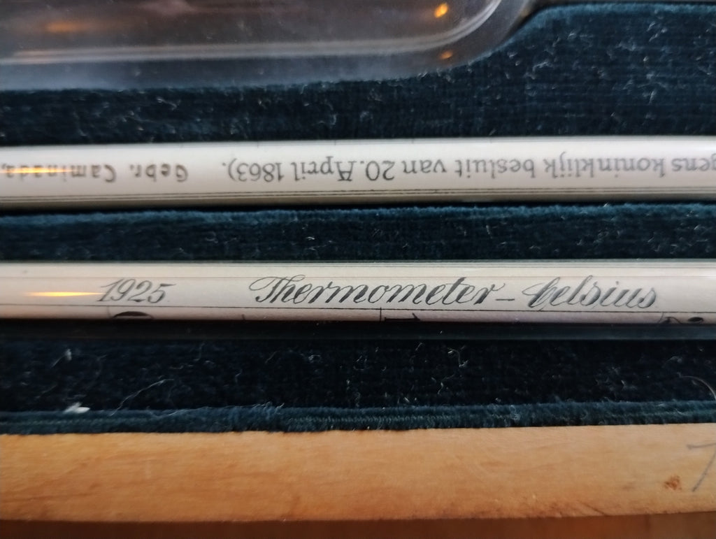 Close-up of the 1925 marking and Thermometer-Celsius inscription beside a Gebr. Caminada glass hydrometer
