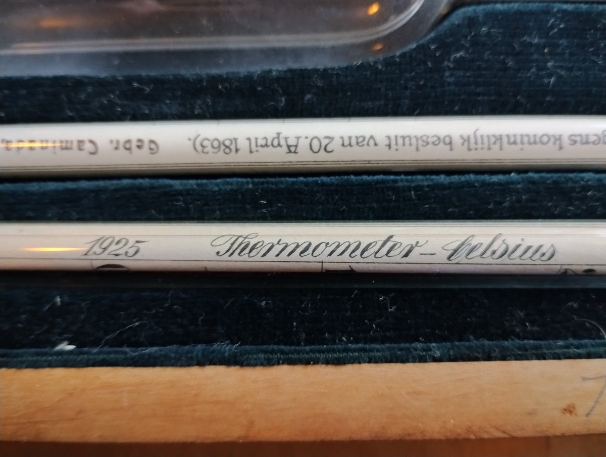 Close-up of the 1925 marking and Thermometer-Celsius inscription beside a Gebr. Caminada glass hydrometer
