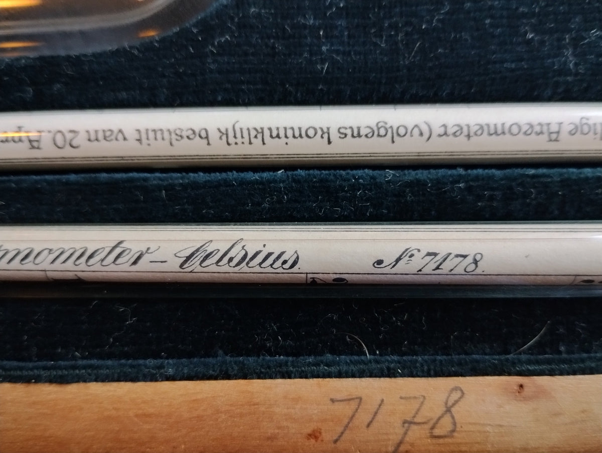 Close-up of Celsius thermometer No. 7178 and the hydrometer inscription referring to the Royal Decree of April 20, 1863
