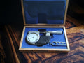 Messwelk 0–25 mm outside micrometer with dial indicator in an open blue-lined wooden case.
