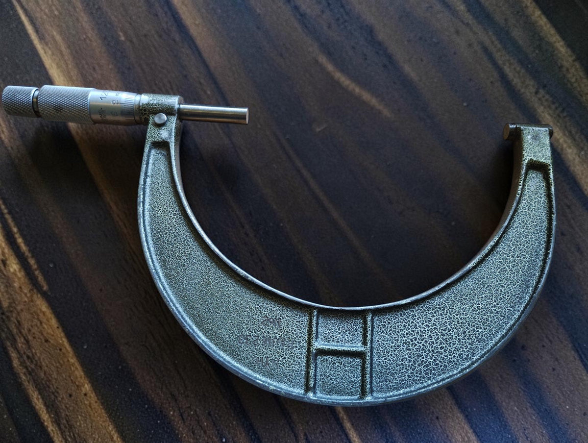 Reverse side of the Hommelwerke 125–150 mm outside micrometer, showing the textured frame and measuring spindle.
