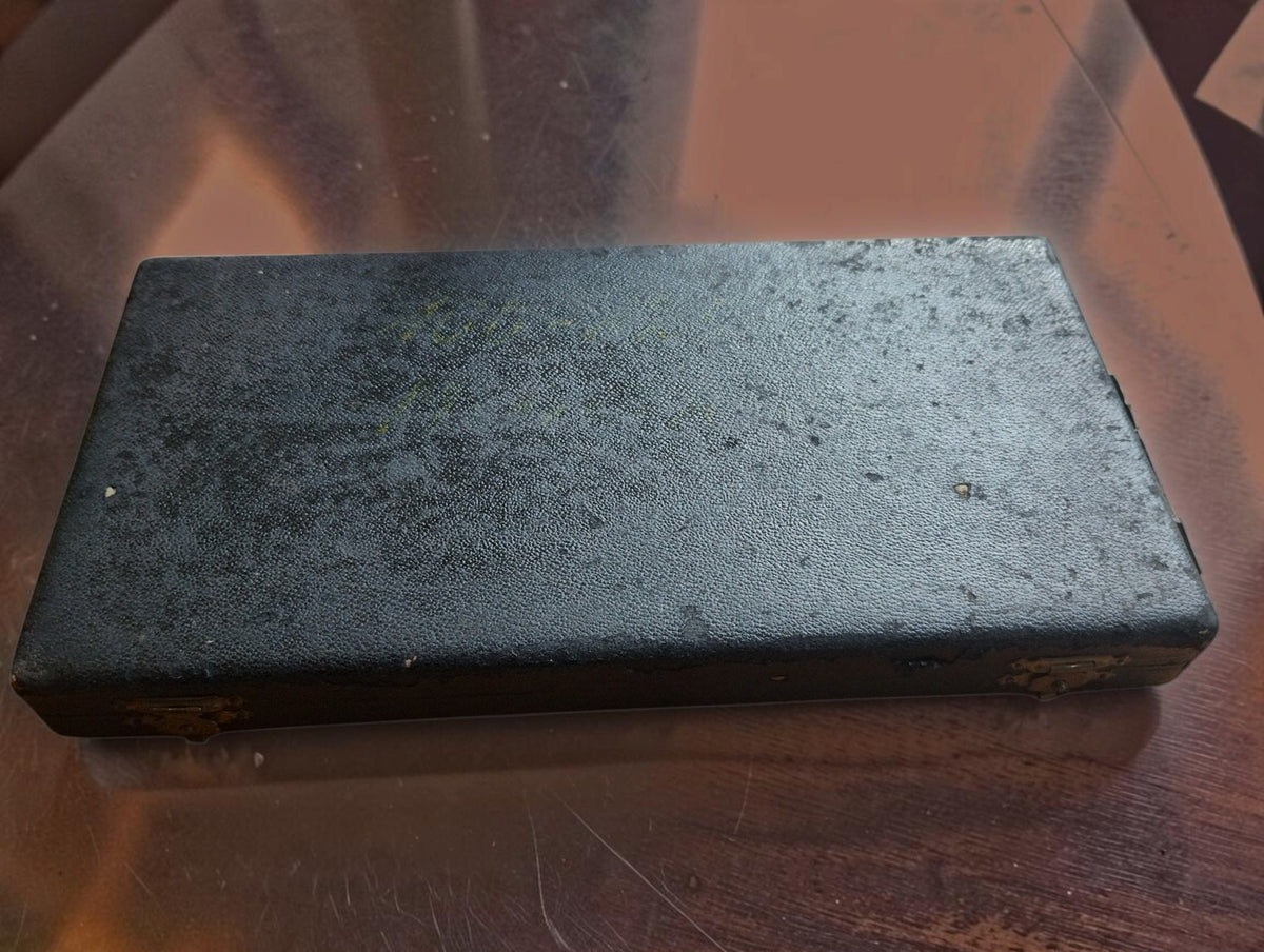 Closed storage case for the P. Roch 150–175 mm outside micrometer, showing wear to the dark exterior covering.
