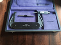 P. Roch Rolle 100–125 mm outside micrometer with separate measuring rod in an open purple-lined case.
