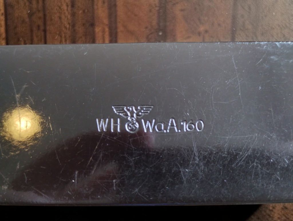 Close-up of the eagle emblem and WH and WaA160 markings on the back of the P. Roch micrometer.
