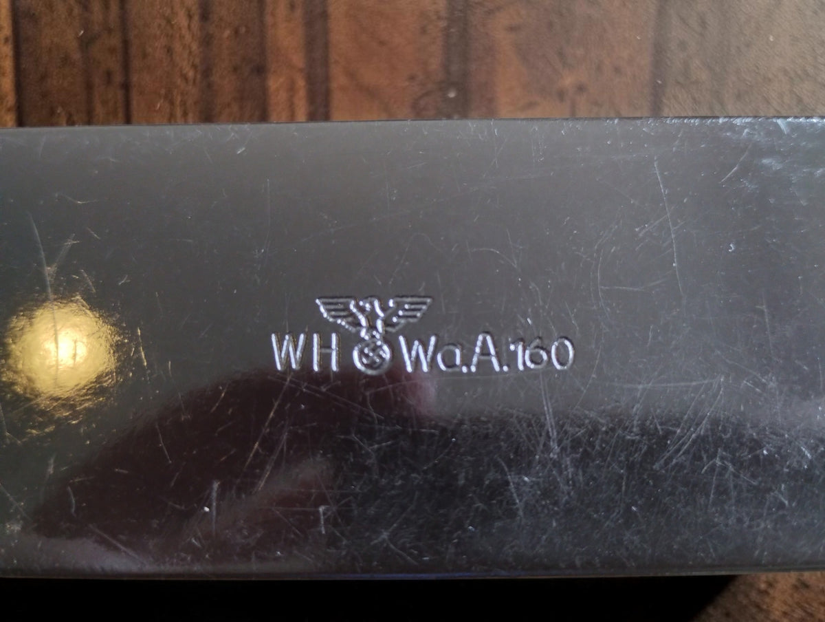 Close-up of the eagle emblem and WH and WaA160 markings on the back of the P. Roch micrometer.
