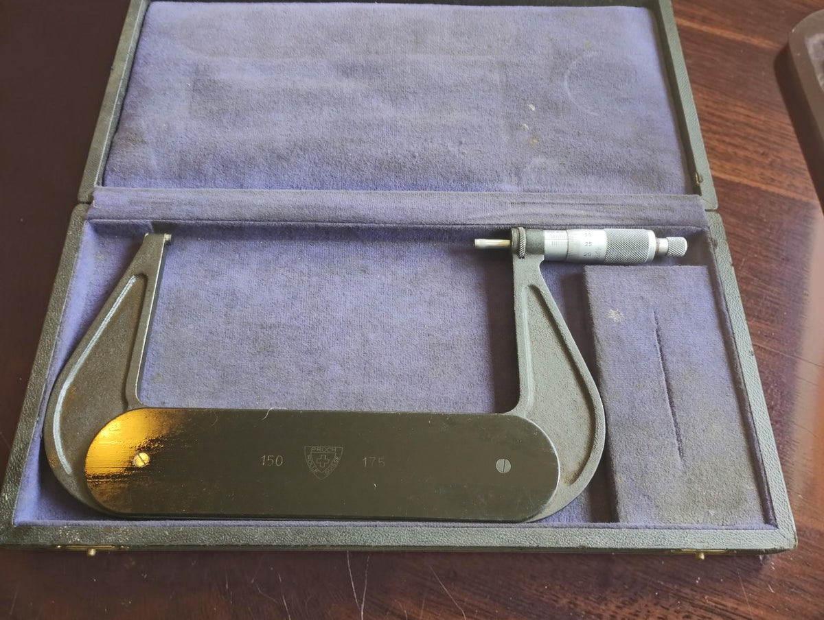 P. Roch Rolle Suisse 150–175 mm outside micrometer in its open purple-lined storage case.
