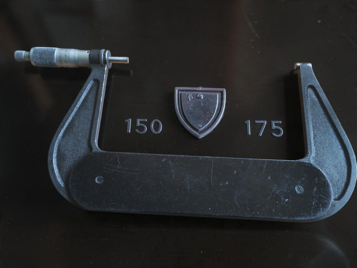 P. Roch 150–175 mm outside micrometer with enlarged details of the shield emblem and range markings.
