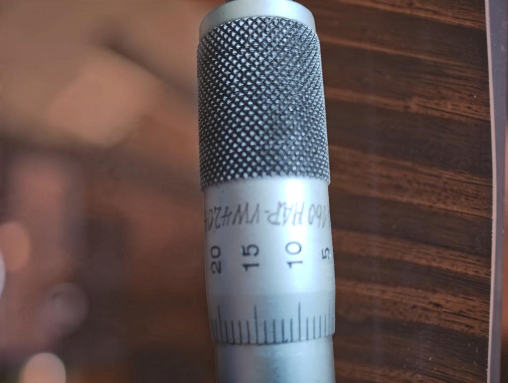 Another view of the P. Roch micrometer thimble showing hand-engraved characters above the graduated scale.
