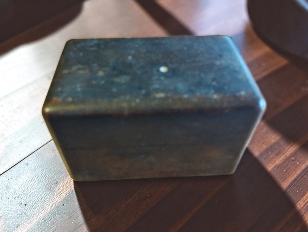 Closed wooden storage box for the antique Jacot-tool spare parts, showing wear to the exterior
