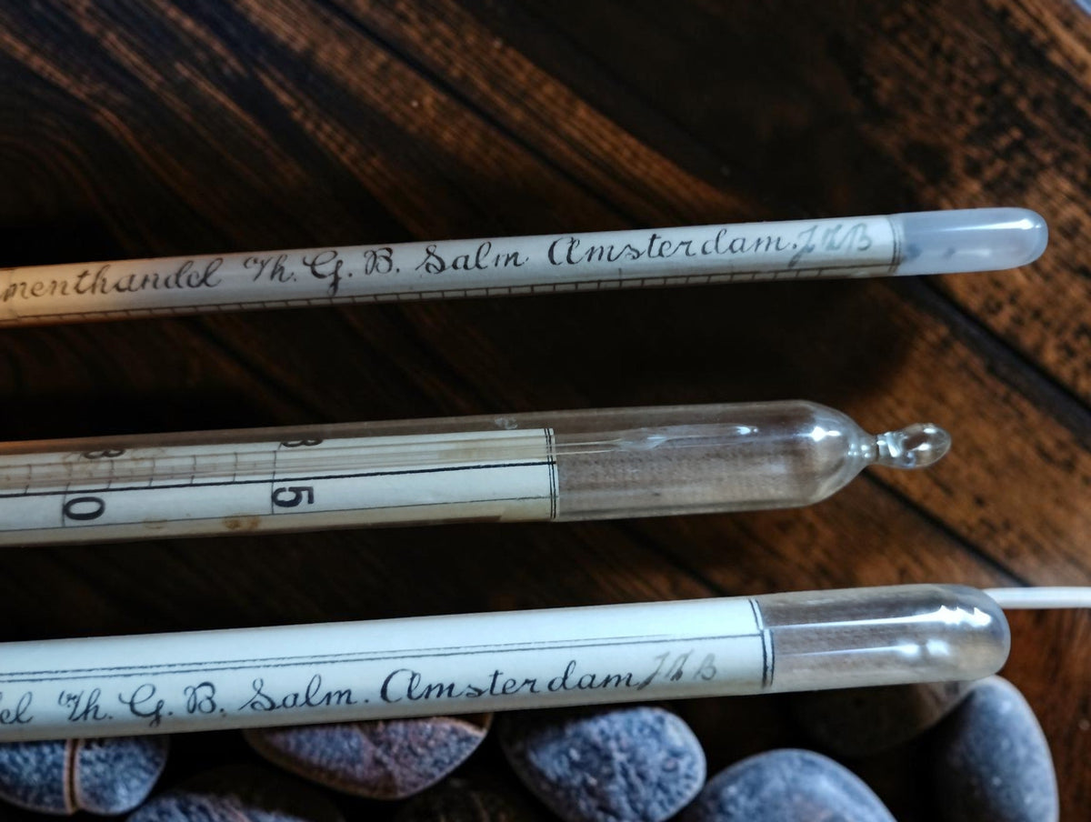 Glass instrument tips and handwritten G. B. Salm Amsterdam markings on the alcohol hydrometers.

