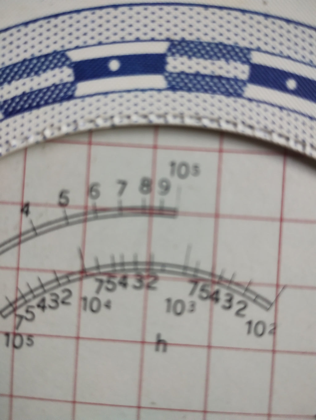 Close-up of the upper numbered scales and blue-and-white rim on the RIV bearing life calculator.
