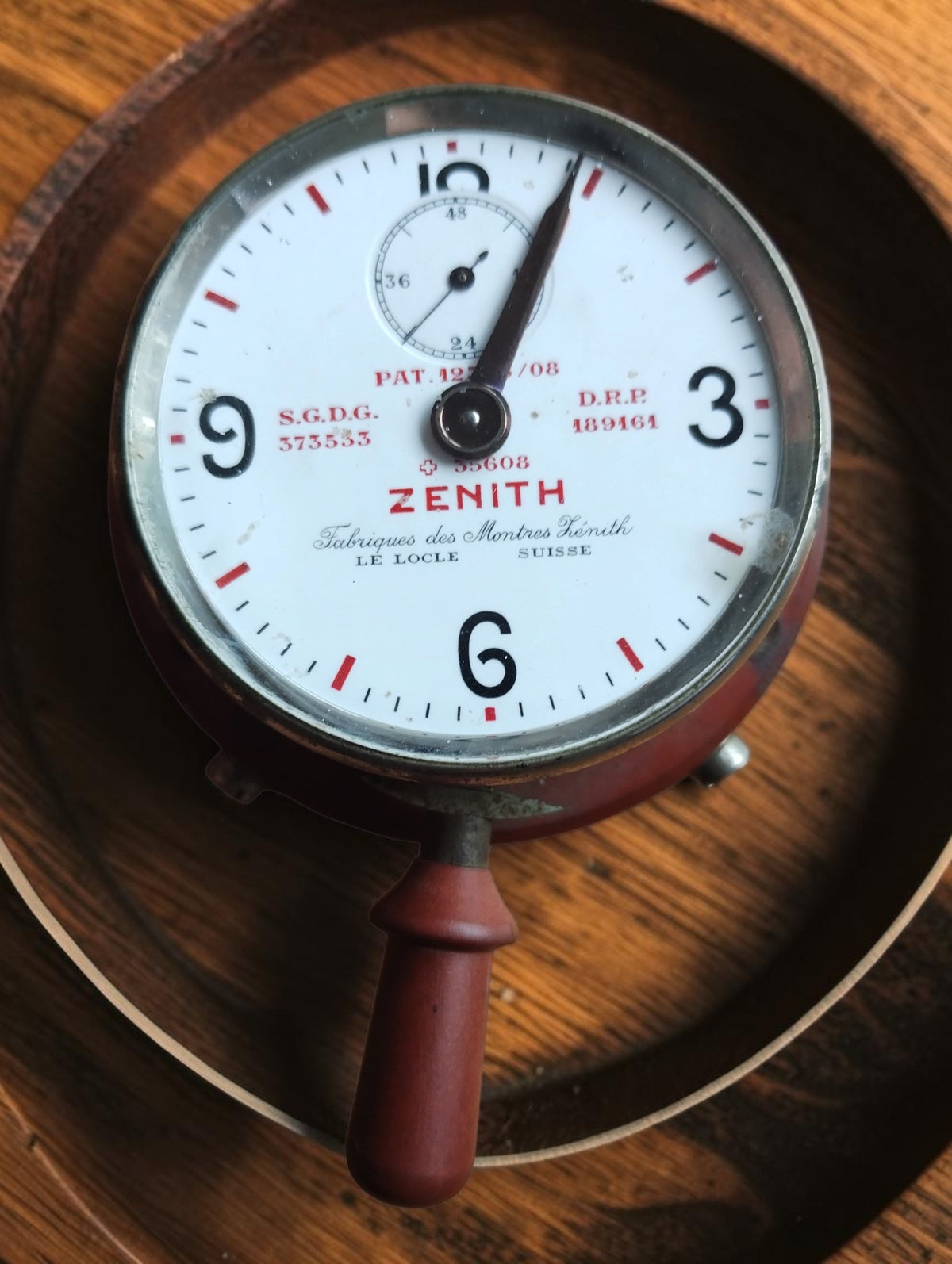 Zenith Le Locle Suisse telephone conversation timer, front view showing the main dial, small counter, operating handle and side button.
