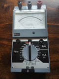 Metrawatt Unigor 3p vintage analog multimeter, full front view showing the mirrored scale, central range selector and three terminals.
