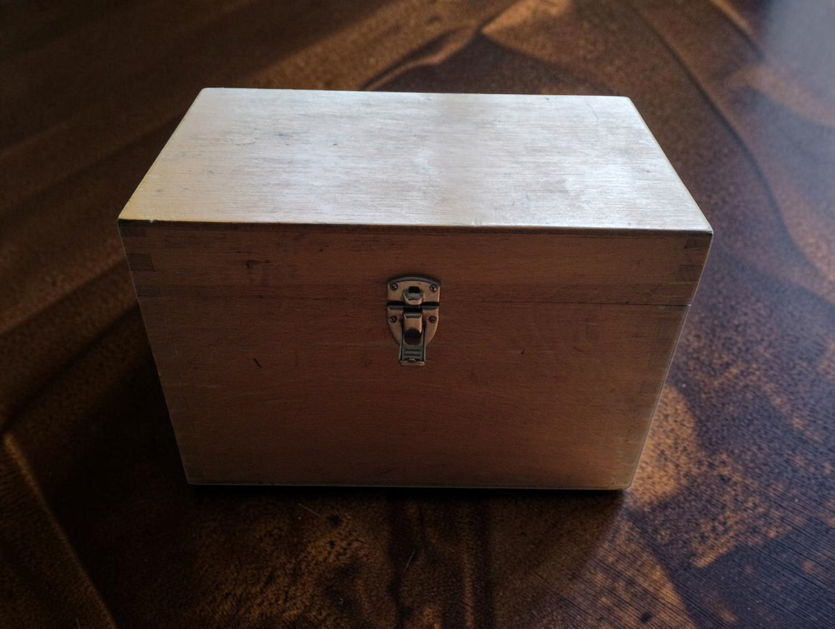 Closed wooden storage case with metal clasp for the VEB Energiekombinat Potsdam NES I/62 electrical safety tester.
