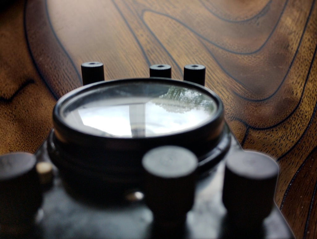 Low side view of the Gossen Mavometer showing the raised glass dial window and terminal arrangement.
