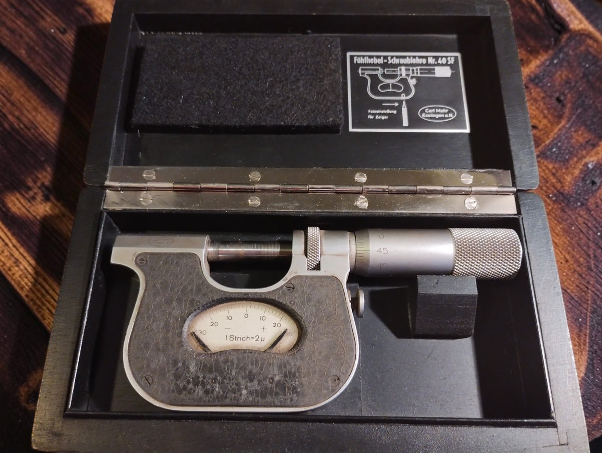 Carl Mahr Nr. 40 SF indicating micrometer in its open wooden case with factory diagram inside the lid
