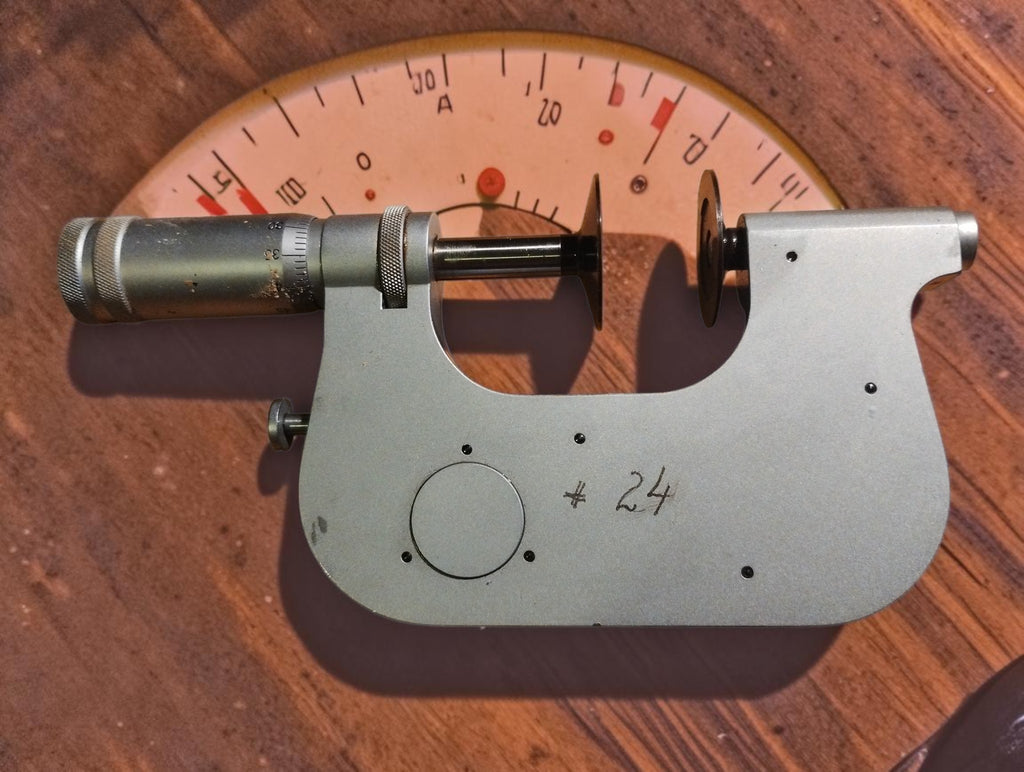 Rear view of the Carl Zeiss Jena disc micrometer showing the silver-colored frame and handwritten number 24.

