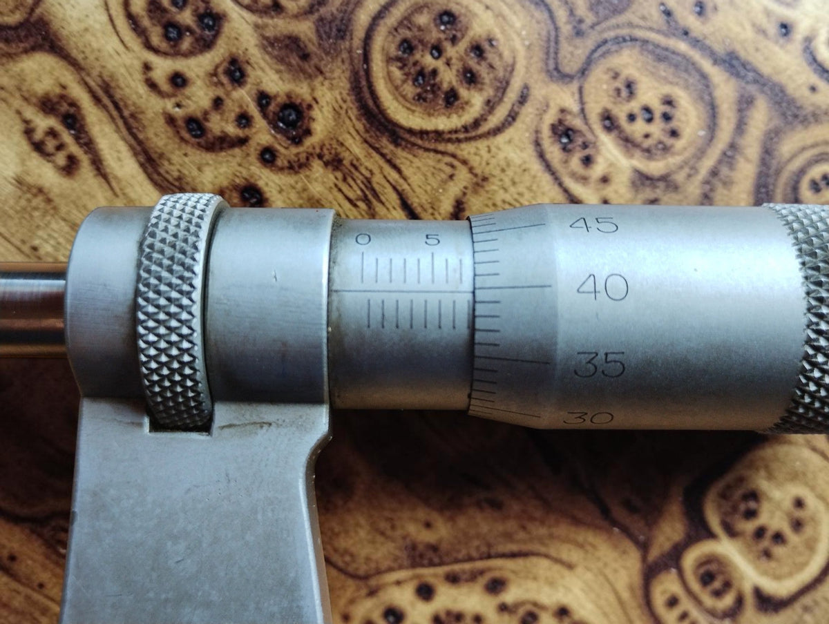 Close-up of the engraved sleeve and thimble scales on the Mahr Esslingen outside micrometer.
