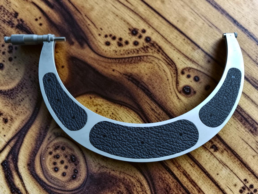 Mahr Esslingen 250–300 mm outside micrometer with black textured insulating grips, spindle assembly on the left.

