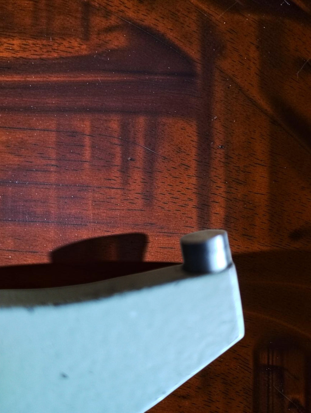 Close-up of the outside micrometer's fixed anvil and frame end.
