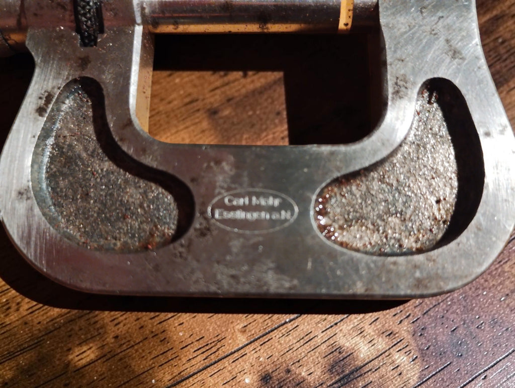Close-up of the Carl Mohr Esslingen a.N. maker’s mark and textured micrometer frame
