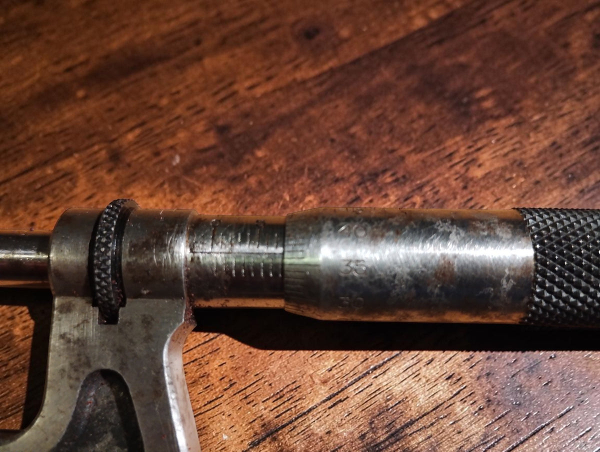 Detail of the Carl Mohr micrometer sleeve scale, locking ring, and knurled thimble
