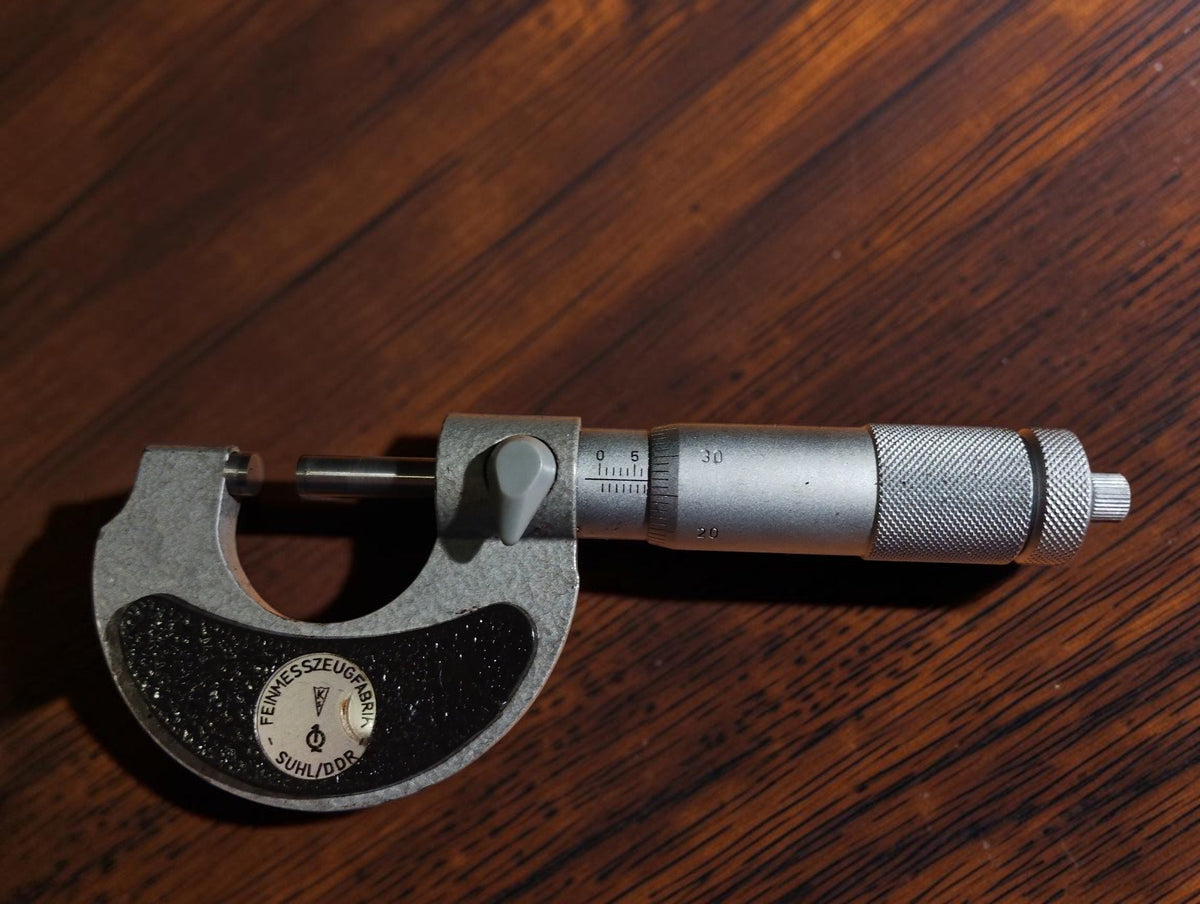 Feinmesszeugfabrik Suhl DDR outside micrometer, 0–25 mm, with metal frame and black textured grip
