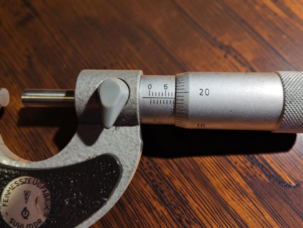 Close-up of the graduated sleeve, rotating thimble and spindle lock on the Suhl DDR micrometer
