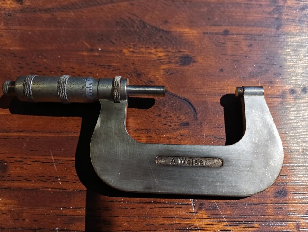Reverse side of the Carl Zeiss Jena outside micrometer, showing the A. Weiser nameplate and knurled adjustment grips.
