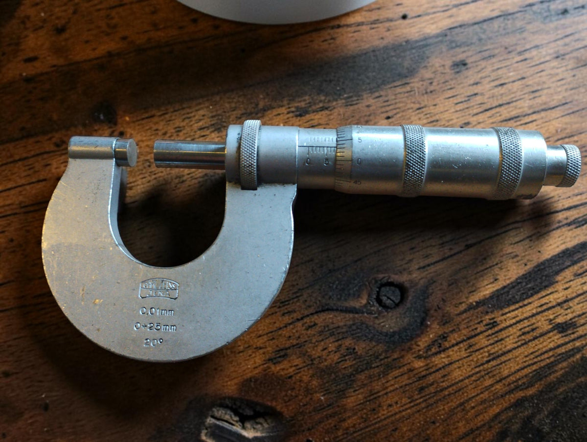 Carl Zeiss Jena 0–25 mm outside micrometer showing the maker's logo, measuring faces and graduated thimble.
