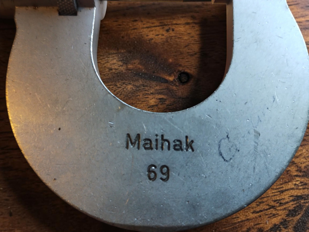 Close-up of the Maihak 69 marking on the frame of a vintage Carl Zeiss Jena outside micrometer.
