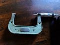 Mauser Gen. 1 outside micrometer, 75–100 mm, with green hammer-finish frame and metal measuring head.
