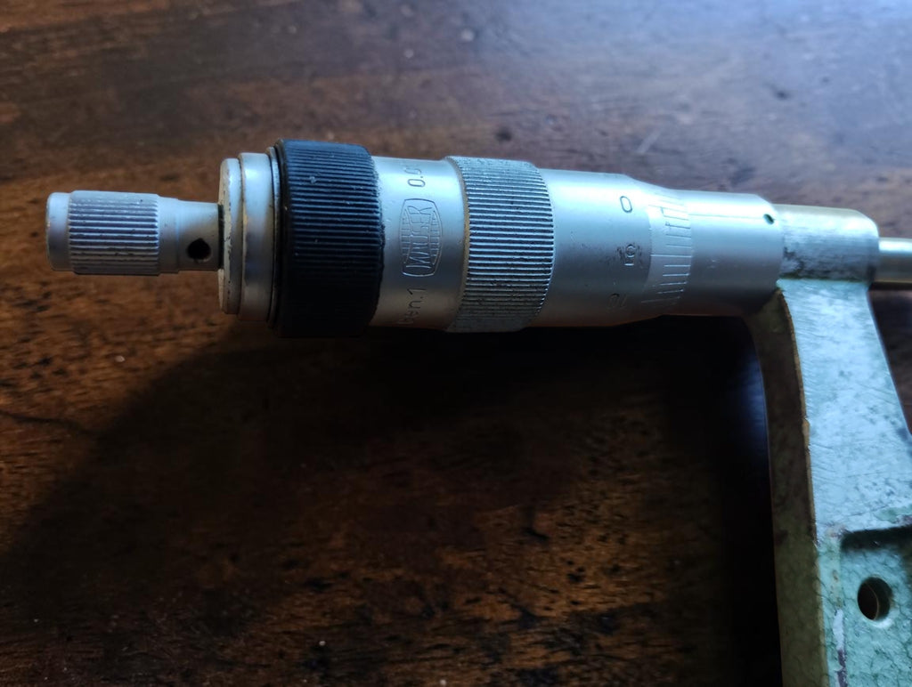 Close-up of the Mauser micrometer measuring head, showing the graduated scale, knurled thimble and black adjustment ring.

