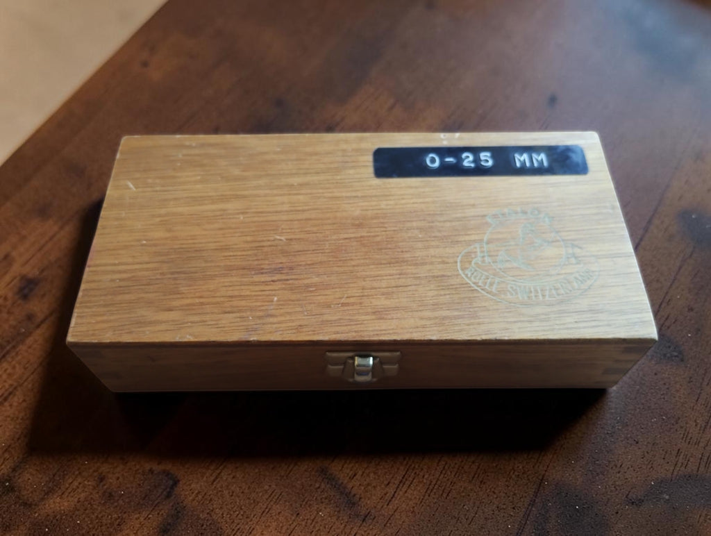 Closed wooden case for the Etalon Microselect 0–25 mm micrometer, showing the front clasp
