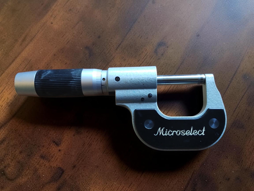 Etalon Microselect outside micrometer viewed from the back, with black ribbed thimble grip
